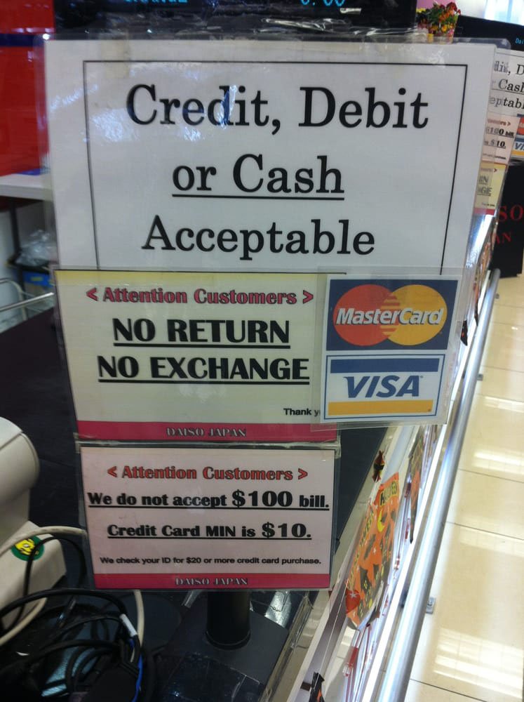 A No Return No Exchange sign posted at a store checkout